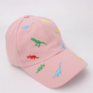Detail shot of colorful dinosaur embroidery on a pink cotton twill baseball cap
