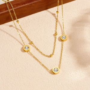 Double-layered stainless steel necklace with Roman numeral disk pendant and zircon stone