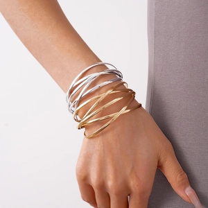 Minimalist multi-layer geometric stacked metal bangle in silver and gold for women