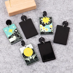 Punk style tarot skull earrings in black acrylic featuring The Star and Sun prints