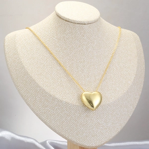 Minimalist gold heart pendant necklace with high-polish mirror finish and O-chain