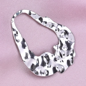 Detailed view of silver hammered 304 stainless steel drop pendant with unique texture