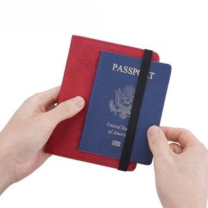Red PU leather RFID passport holder with elastic closure and minimalist embossed design