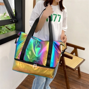 Holographic high capacity travel bag with dry wet separation and trolley sleeve