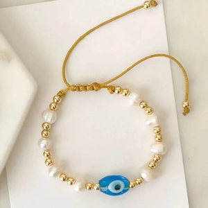 Adjustable evil eye charm bracelet with natural freshwater pearls and 18K gold beads