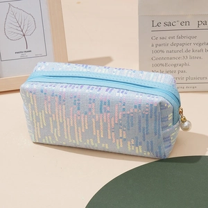 Fashionable light blue sequined pencil case with pearl zipper and shimmering vertical stripes