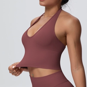 Detail of high-stretch seamless fabric with wide ribbed hem on halter yoga sports bra