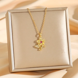 Exquisite gold floral titanium steel necklace with red gemstone and micro-pave diamonds