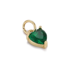 Detail of gold-plated heart pendant featuring a faceted green zircon gemstone