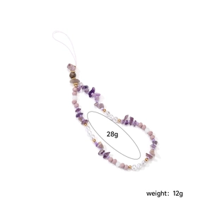 Close-up of handmade beaded phone strap with amethyst, pink beads and white pearls