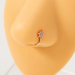 Rose gold U-shaped nose ring with sparkling star zircon on a realistic nose model