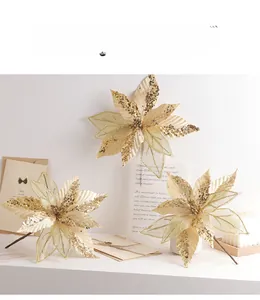 Detailed view of 30cm champagne gold artificial Christmas poinsettias with glitter petals