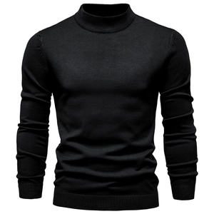 Close-up of black turtle neck knit sweater showing high-quality fine rib texture and fit