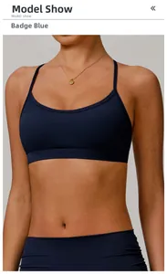 Detail of cross back straps and stretch fabric on the badge blue sports bra set