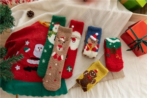 Cozy coral fleece Christmas socks set with festive reindeer and Santa patterns