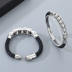 Close-up of black braided leather bracelet with silver bicycle chain style metal buckle