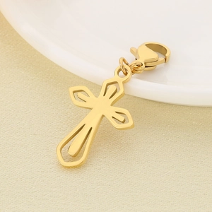 Detailed view of hollow gold cross pendant with lobster clasp and shiny metallic finish