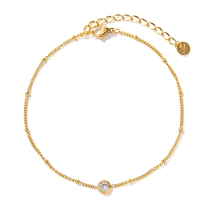 Gold stainless steel anklet with circular white zircon pendant on a minimalist chain