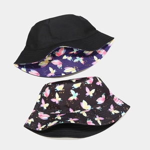 Double-sided bucket hat with colorful butterfly music notes and classic black side