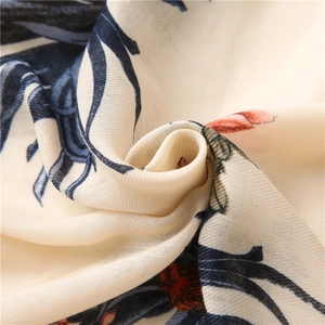 Linen cotton scarf with elegant beige floral print and blue leaf texture detail