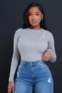 Close-up of blue washed ripped denim texture and high-waisted wide-leg jeans fit