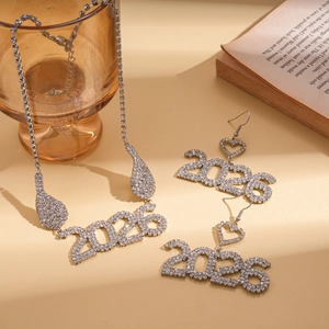 Detail of 2026 silver necklace and earrings set with rhinestones for New Year