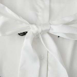 White urban commuter shirt featuring a soft tie-bow collar and elegant beaded details