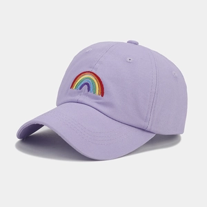 Close-up of rainbow embroidery and reinforced stitching on a lilac cotton baseball cap