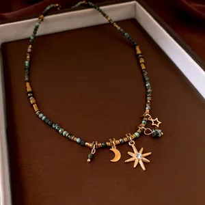 Titanium steel beaded necklace with moon star turquoise charms in vintage gold finish
