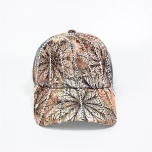 Detail of floral baseball cap with rhinestone lines and metallic star studs decoration
