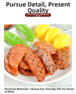 Detailed macro shot of realistic PVC beef steak model with grill marks on a white plate