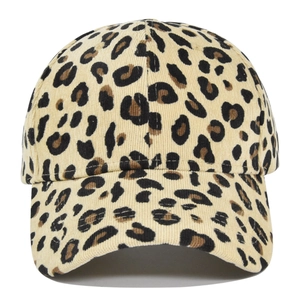 Close-up detail of leopard print baseball cap with ribbed corduroy texture and curved brim