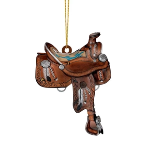 Close-up of Western saddle pendant with Beauty engraving and turquoise feather details