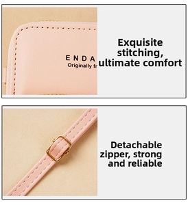 Detail showing the fine stitching and adjustable gold metal buckle on a pink leather bag