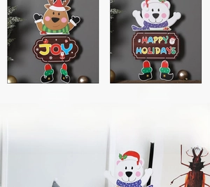 Detailed view of Christmas cartoon deer and bear hanging ornaments with festive joy text