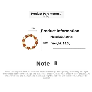 Detail view of geometric acrylic bracelet with gold square beads and brown round beads
