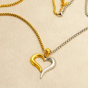 Luxurious two-tone hollow heart pendant necklace with gold and silver box chain