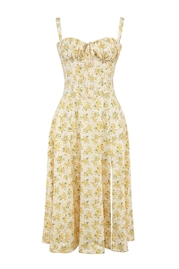 Close-up of floral sundress featuring thin straps, sweetheart neckline, and a side high slit
