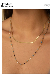 Close-up of double layered 18K gold plated necklace with colorful enamel beads on model