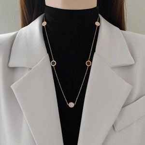 Minimalist titanium steel gold necklace featuring double-sided black round pendant