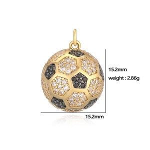 Detailed view of a gold soccer ball pendant with black and white crystals, 15.2mm size