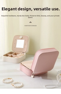 Detail view of portable leather jewelry box interior with mirror and storage compartments