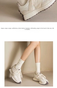 Detail of off-white retro sneakers with suede panels and waffle rubber outsole