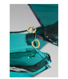 Macro shot showing the S925 hallmark on a polished 18K gold plated silver hoop earring