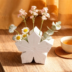 Cherry blossom shaped silicone mold for DIY flower basket crafts on a wooden table