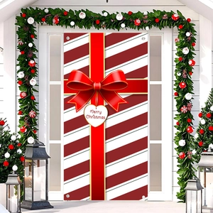 Christmas door banner with red white stripes and large 3D bow on house entrance