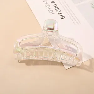 Close-up of holographic rainbow acrylic hair claw clip with large rectangular hollow design
