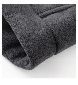 Detailed close-up of double-sided polar fleece hem with premium stitching and texture