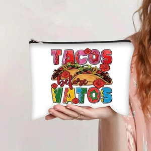 Close-up of canvas makeup bag with Tacos before Vatos print and zipper detail