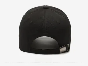 Detail of black cotton baseball cap showing adjustable strap and metal buckle on back